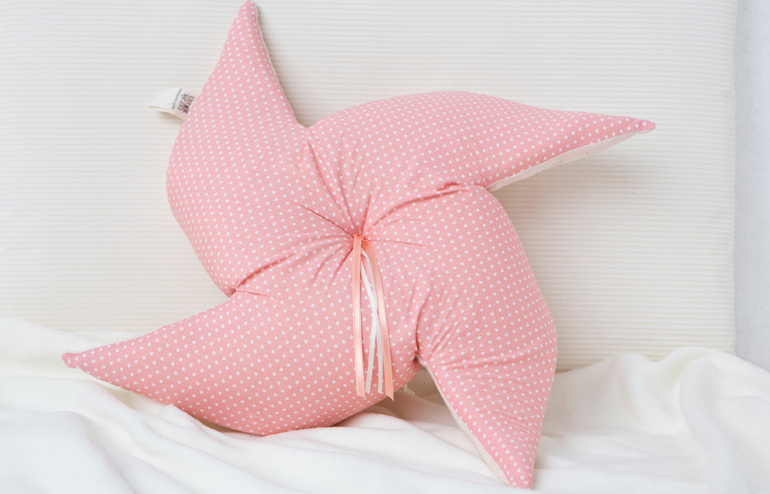 A Pinwheel pillow by Nuppi. // via: Design Break
