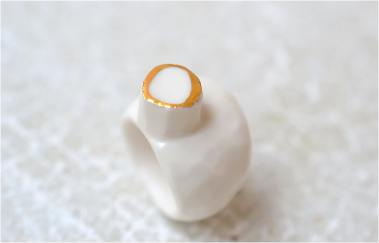  Goutte De Terre‘s white and gold royal ceramic jewelry. // via: Design Break